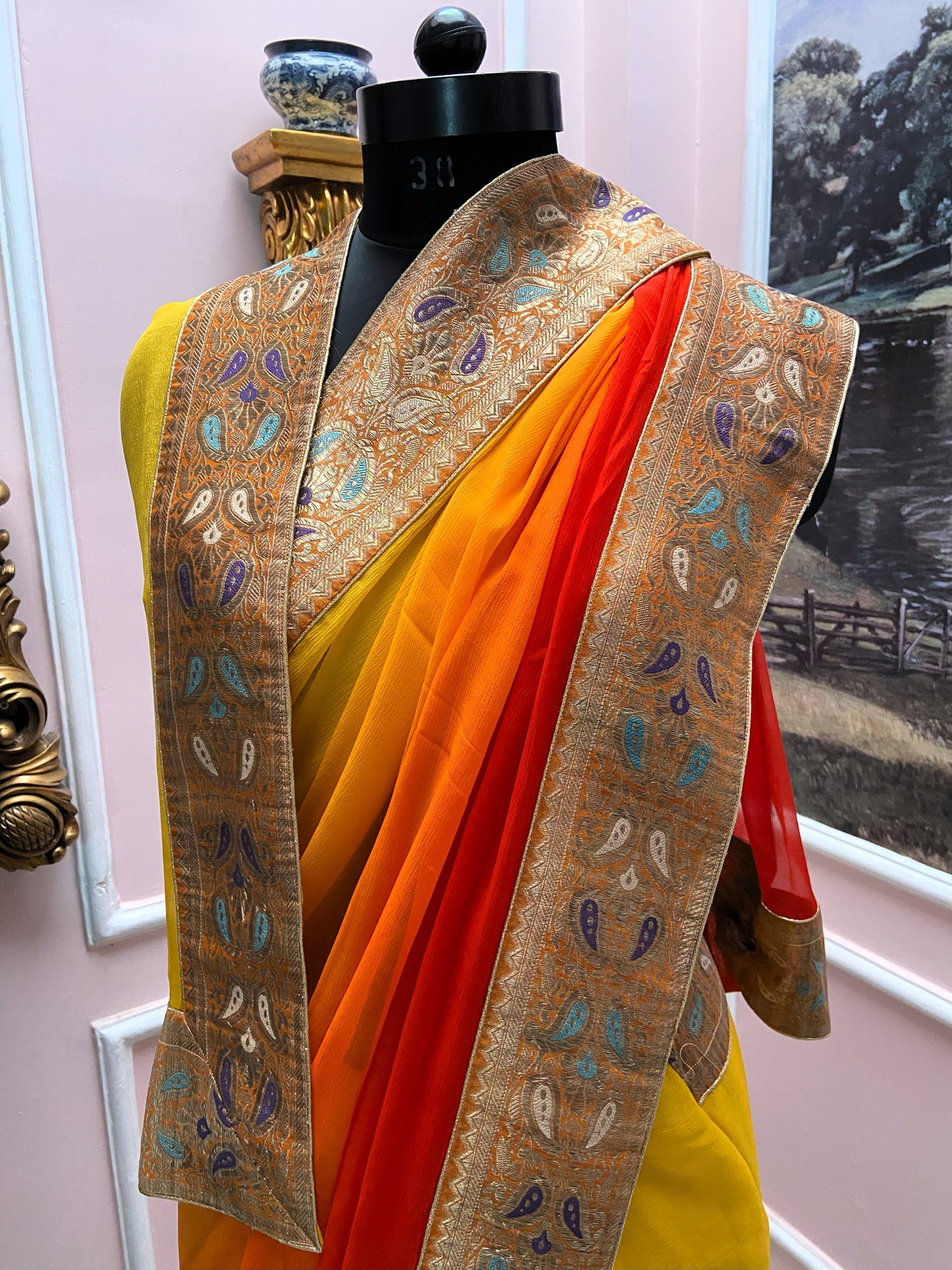 Yellow orange shaded antique border saree