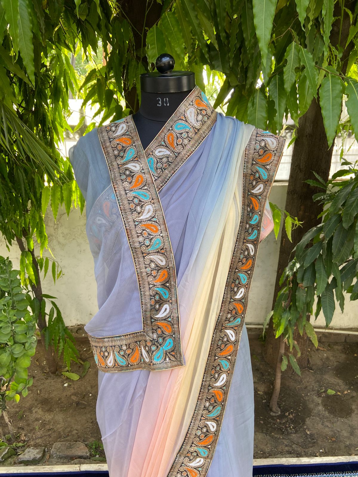Grey to peach shaded antique border saree