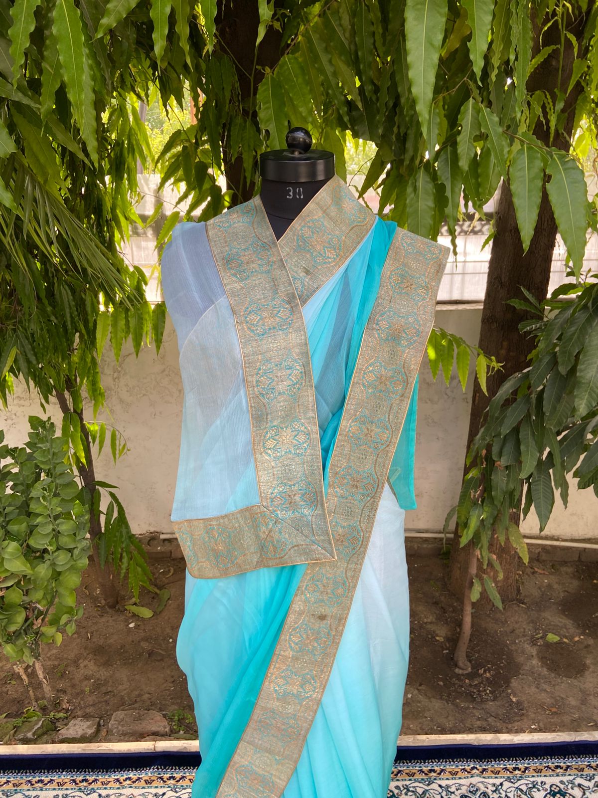Aqua blue shaded antique border saree