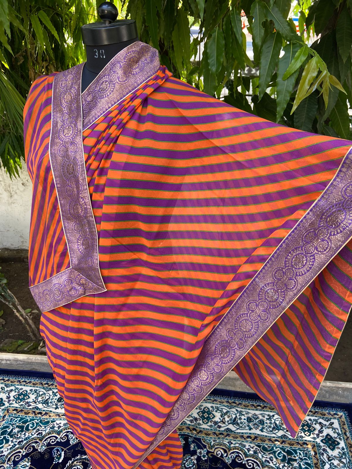 Orange rani multicolor lehariya antique border saree