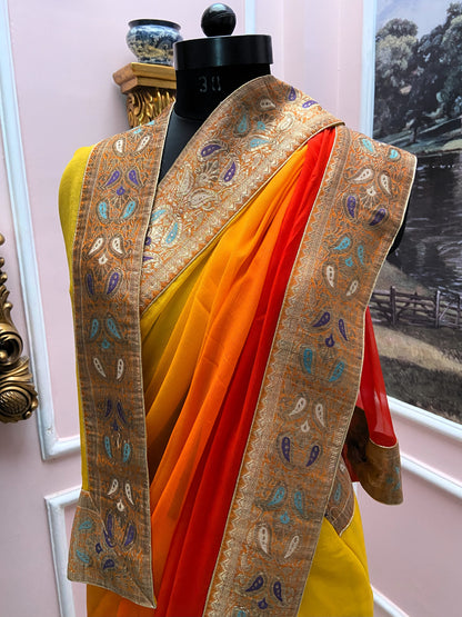 Yellow orange shaded antique border saree