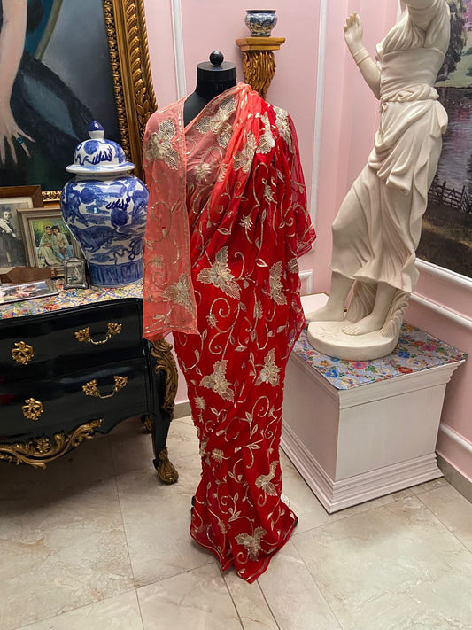 Peach to Red ombre shaded chiffon saree with cutwork jaal