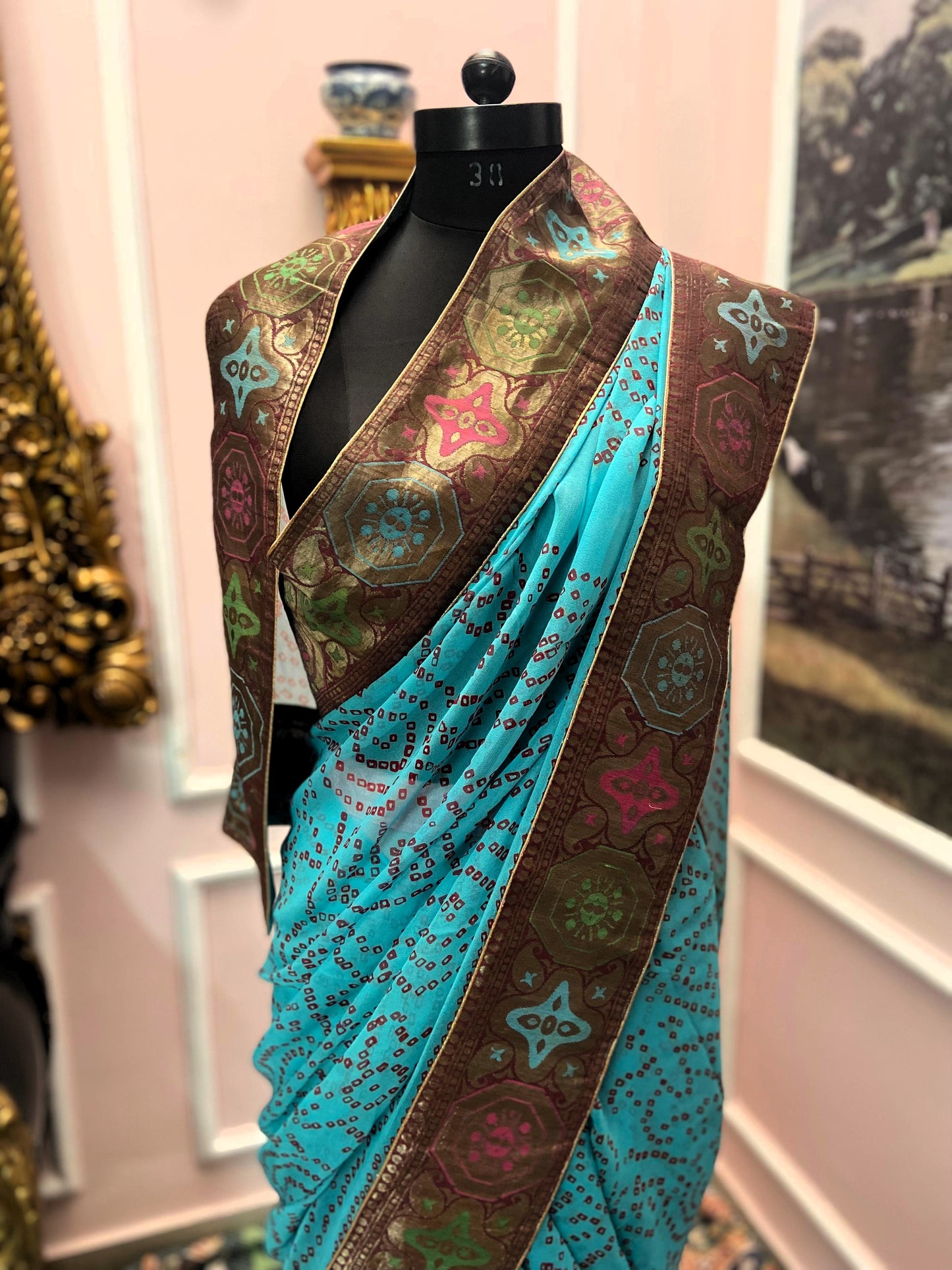 Turquoise blue bandhej antique border saree