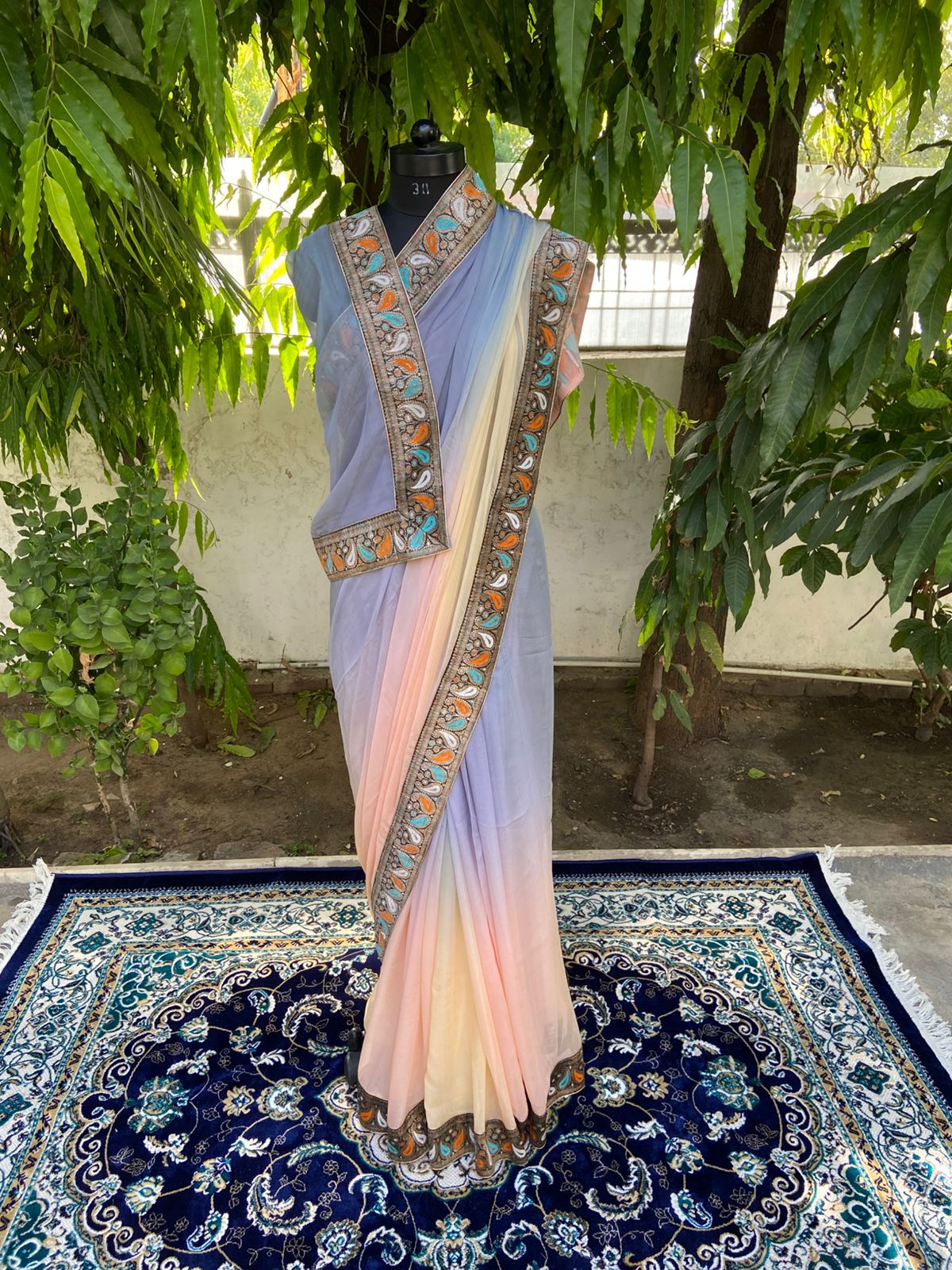 Grey to peach shaded antique border saree