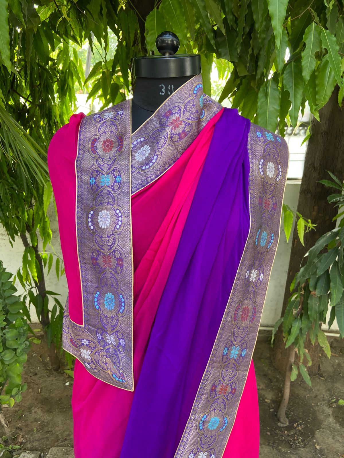 Rani to purple shaded antique border saree
