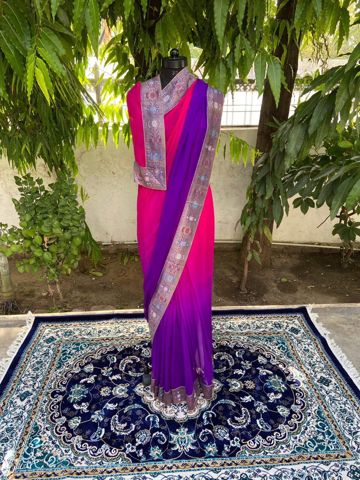 Rani to purple shaded antique border saree
