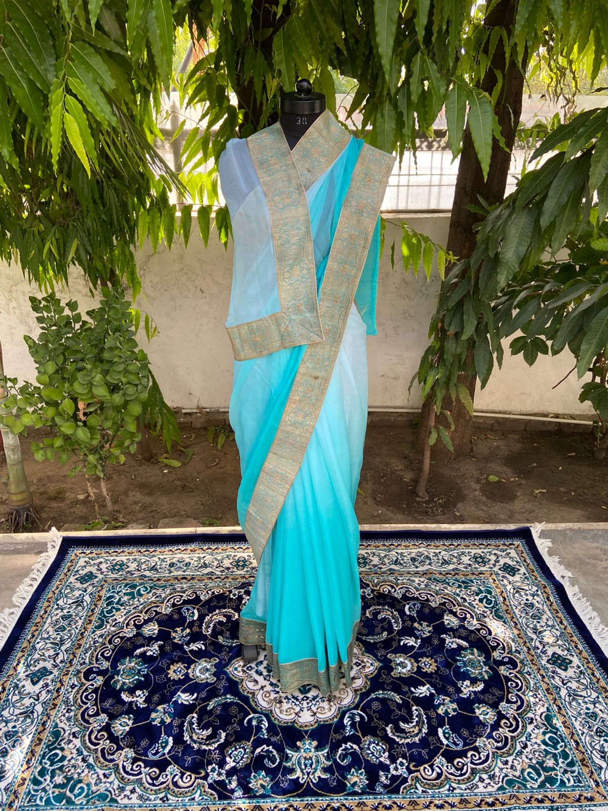 Aqua blue shaded antique border saree