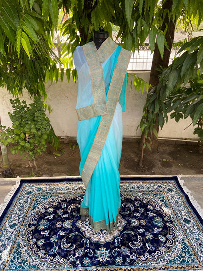 Aqua blue shaded antique border saree