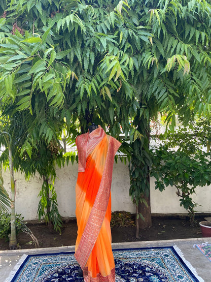 Yellow orange shaded antique border saree