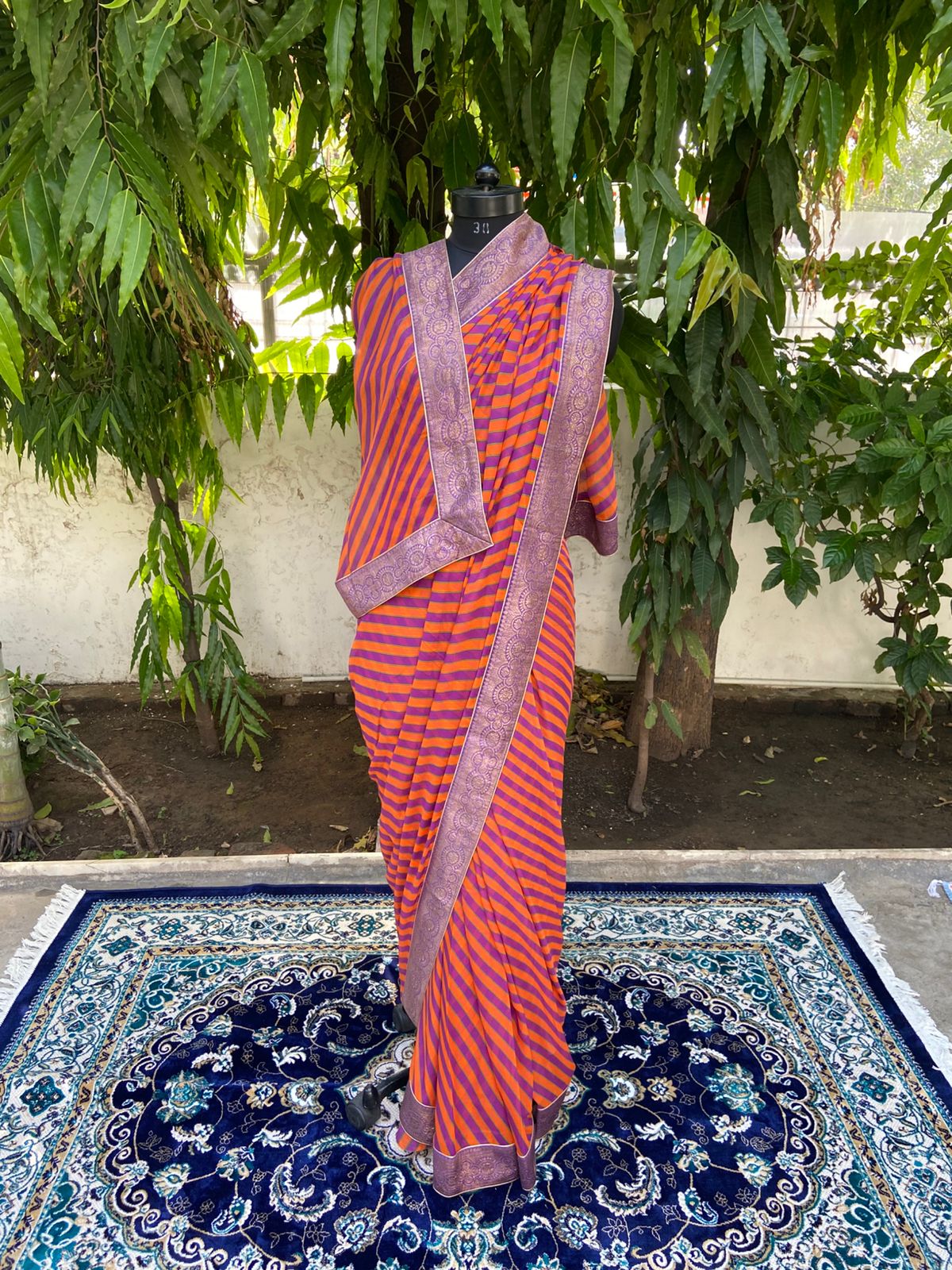 Orange rani multicolor lehariya antique border saree