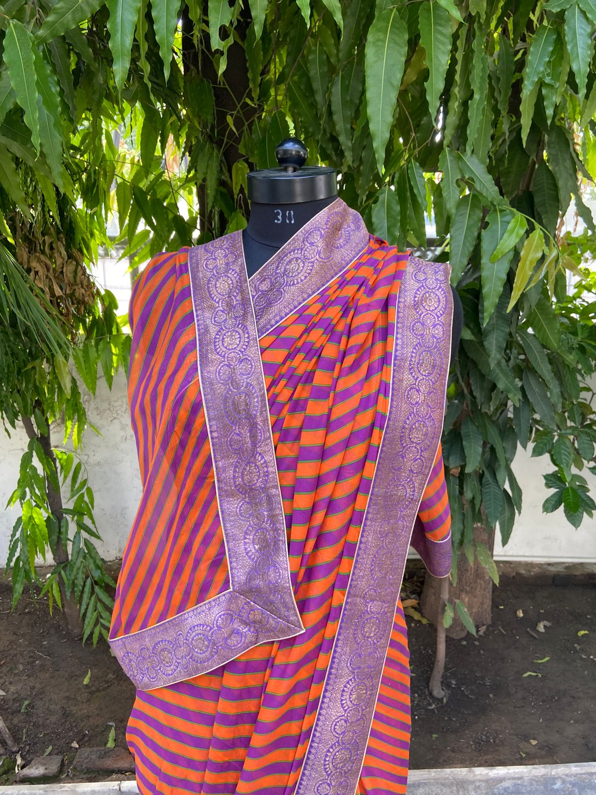 Orange rani multicolor lehariya antique border saree