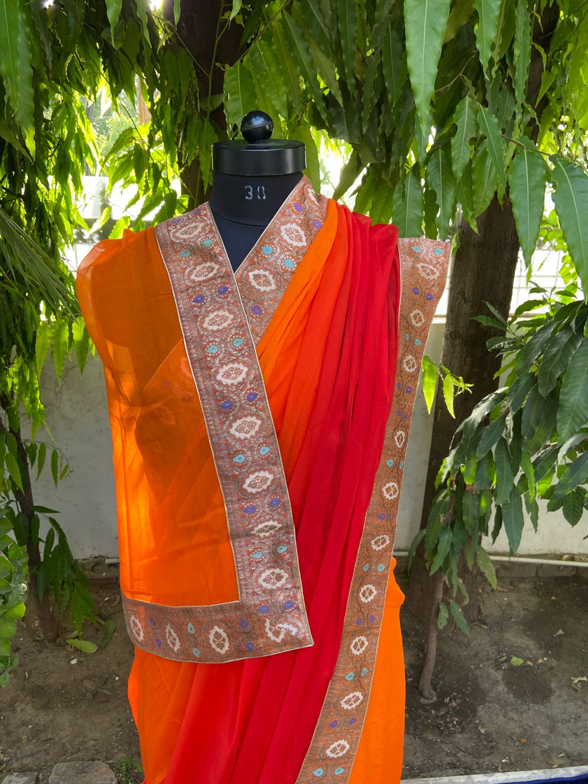 Orange to red antique border saree